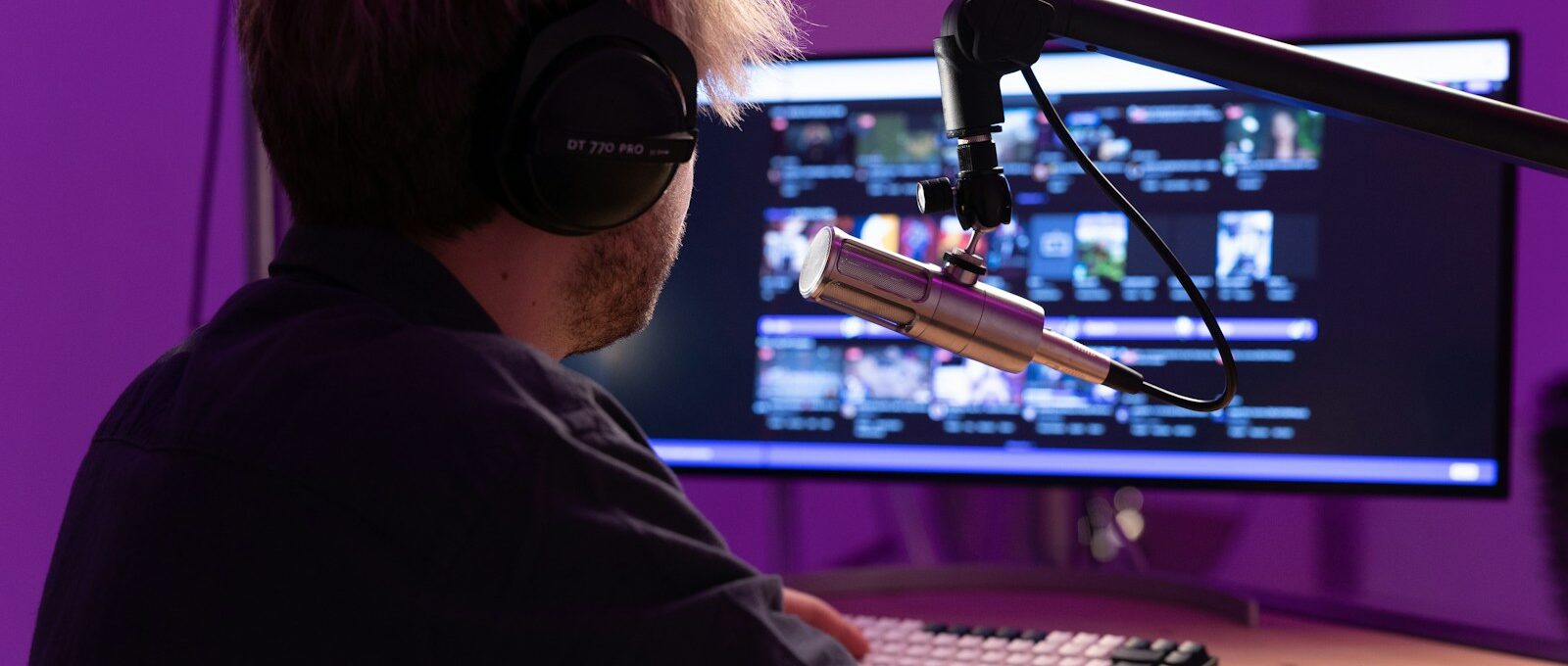 a man wearing a virtual reality headset and playing a keyboard